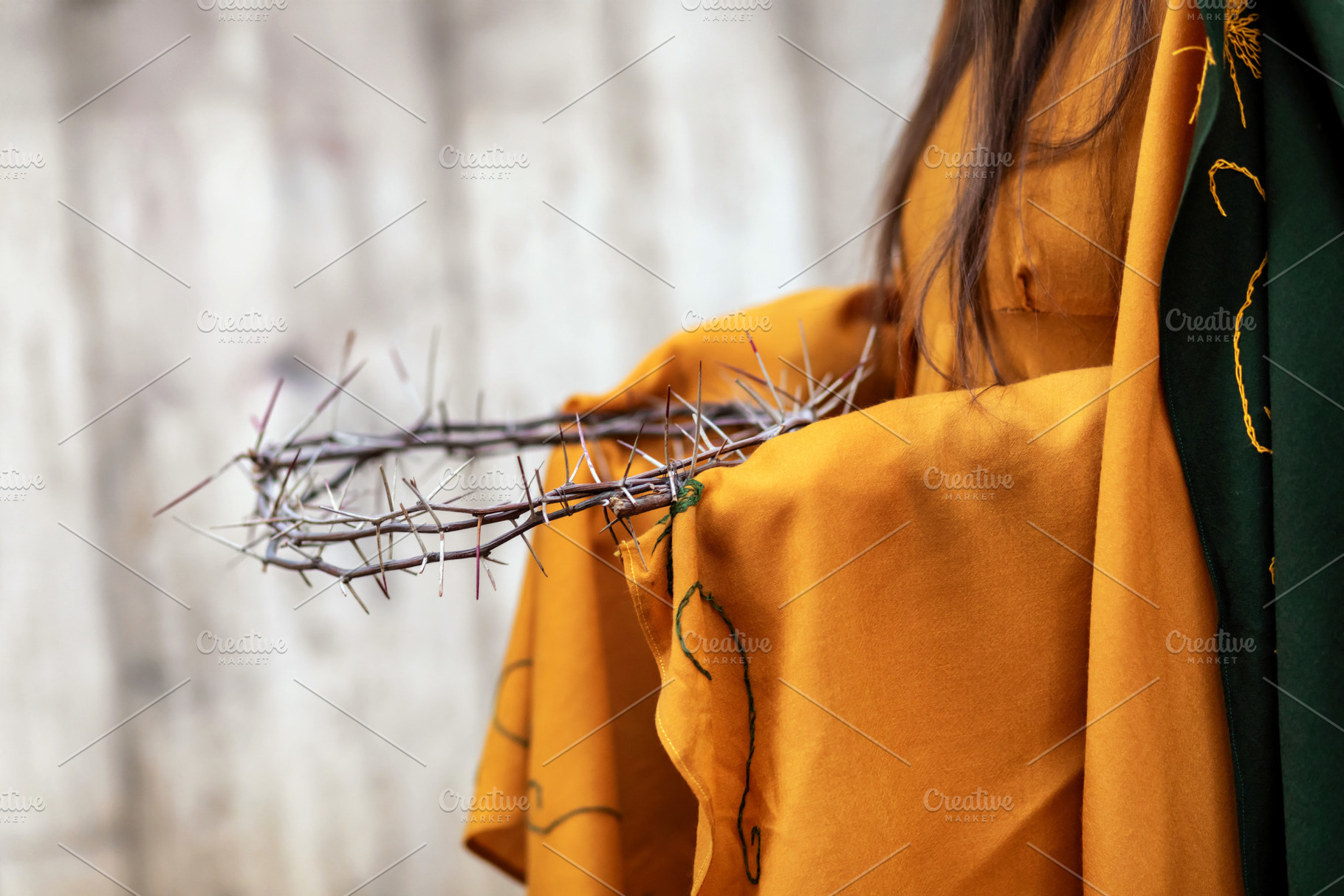 Woman holding crown of thorns, symbol of Jesus Christ's passion, a Holiday Photo by Antonio Gravante Market