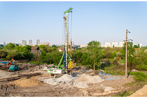 Pile driver at a construction site stock photo containing pile and ukraine, an Industrial Photo by Leonid Andronov