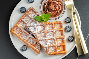 Belgium waffles Homemade waffles with strawberries, a Food & Drink Photo by Budarinphoto