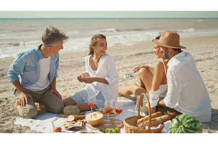 Picnic beach party friends enjoying, a Person Photo by vitaliymateha photography