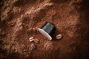 Espresso capsules on pile of coffee beans and isolated backgroun, a Food & Drink Photo by Davizro's Market