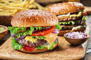 Hamburgers on a wooden board, a Food & Drink Photo by Volff