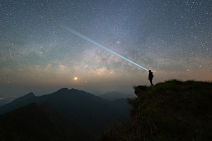 Portrait of Asian woman, a tourist, travel and use flash light a