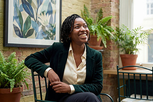 Confident Black Woman Smiling, a Person Photo by Virgo Studio