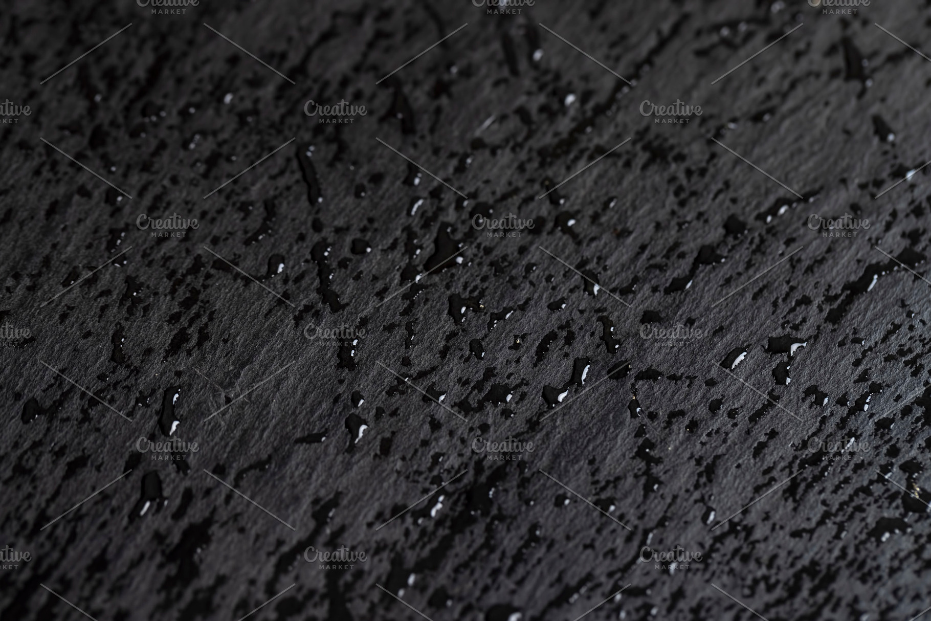 covered with water droplets natural stone black slate is used for decorative pu, a Photo by rsoollAI
