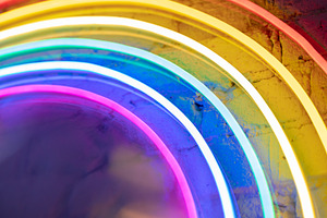 Neon rainbow background featuring magical, blurry, and contemporary