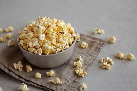 Homemade Salty Popcorn in a Bowl, side view., a Food & Drink Photo by LiudmylaChuhunova