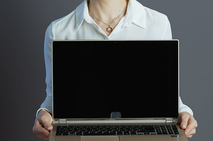 happy business owner woman showing laptop blank screen, a Business Photo by Alliance Images