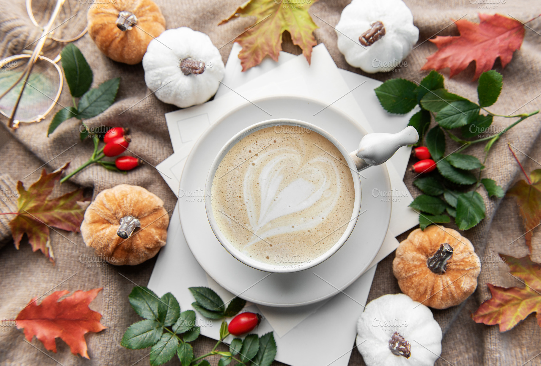Autumn latte art heart with fall pumpkins and leaves, a Holiday Photo by Olena Rudo