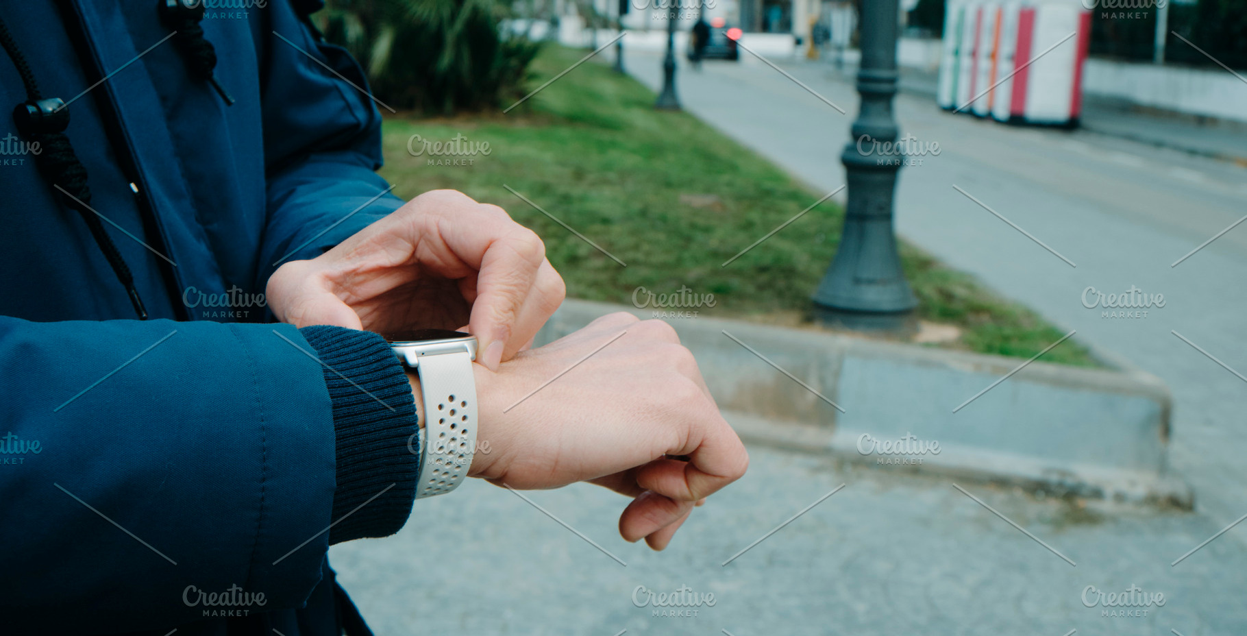 man activating the GPS tracker on his smartwatch, a Photo by Nito