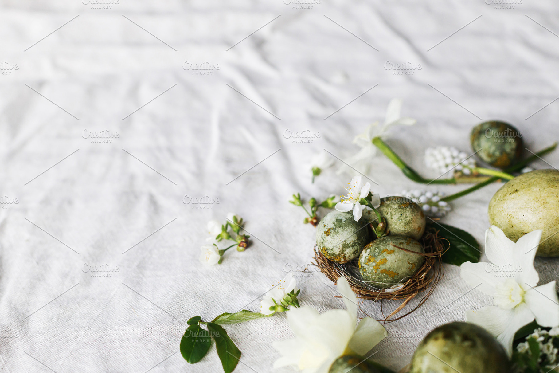 Happy Easter! Stylish natural dyed eggs in nest and spring flowe, a Holiday Photo by Sonjachni