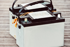 Car batteries sitting on wooden, a Photo by Dvoevnore photos