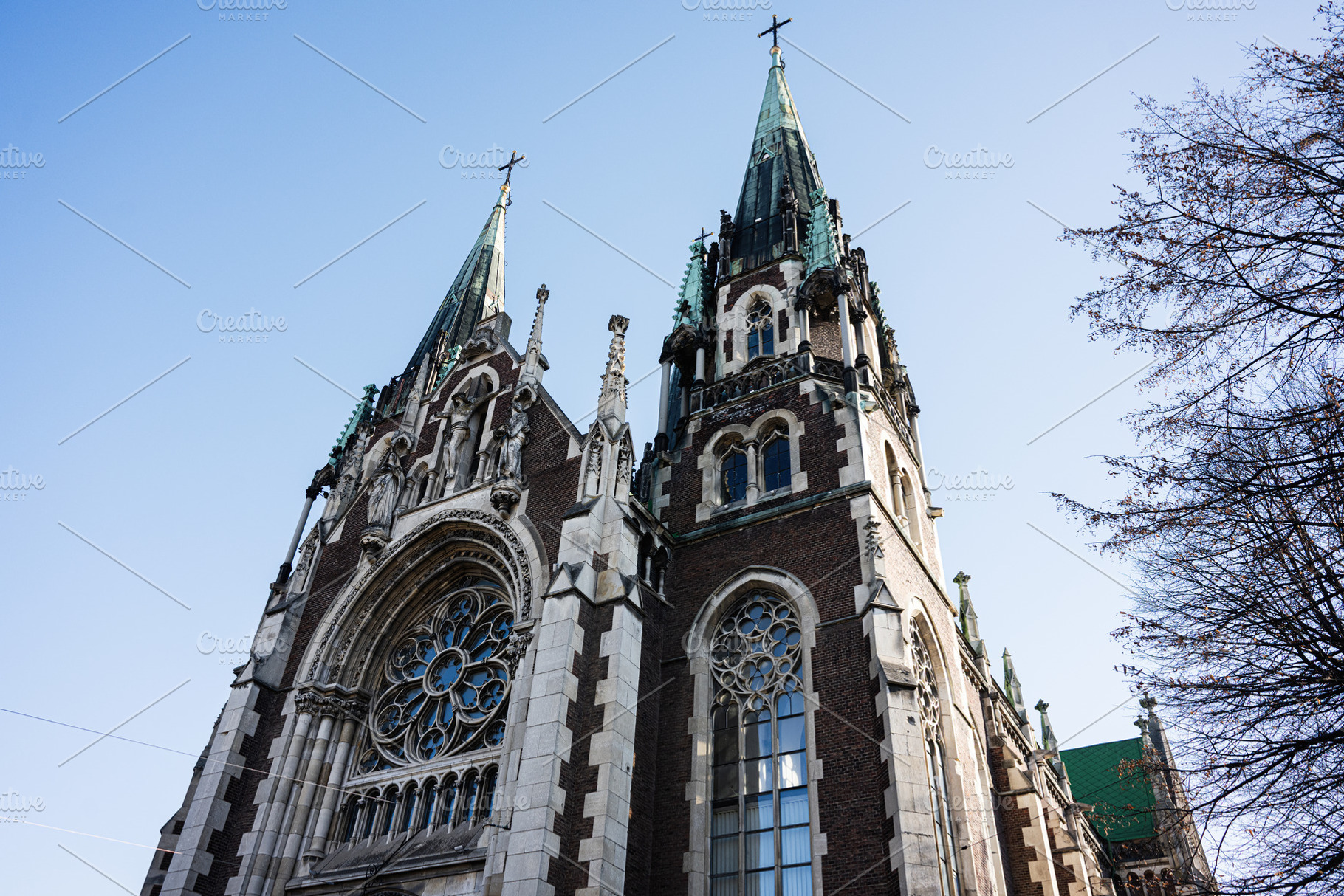Neo Gothic Church of Sts. Olha and Elizabeth architecture in Lviv against a cle, a Photo by AS photostudio