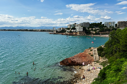 Coastal view of La Pineda beach in Tarragona, Spain on a sunny day, a Photo by AS photostudio