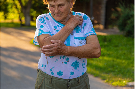 Old woman arm hurts, elbow, a Health & Medical Photo by yanadjana