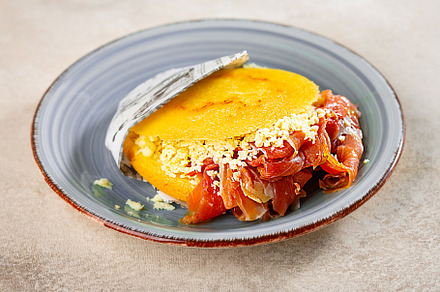 Stuffed arepa made from cornmeal, traditional cuisine of Colombia and Venezuela, a Food & Drink Photo by zakiroff