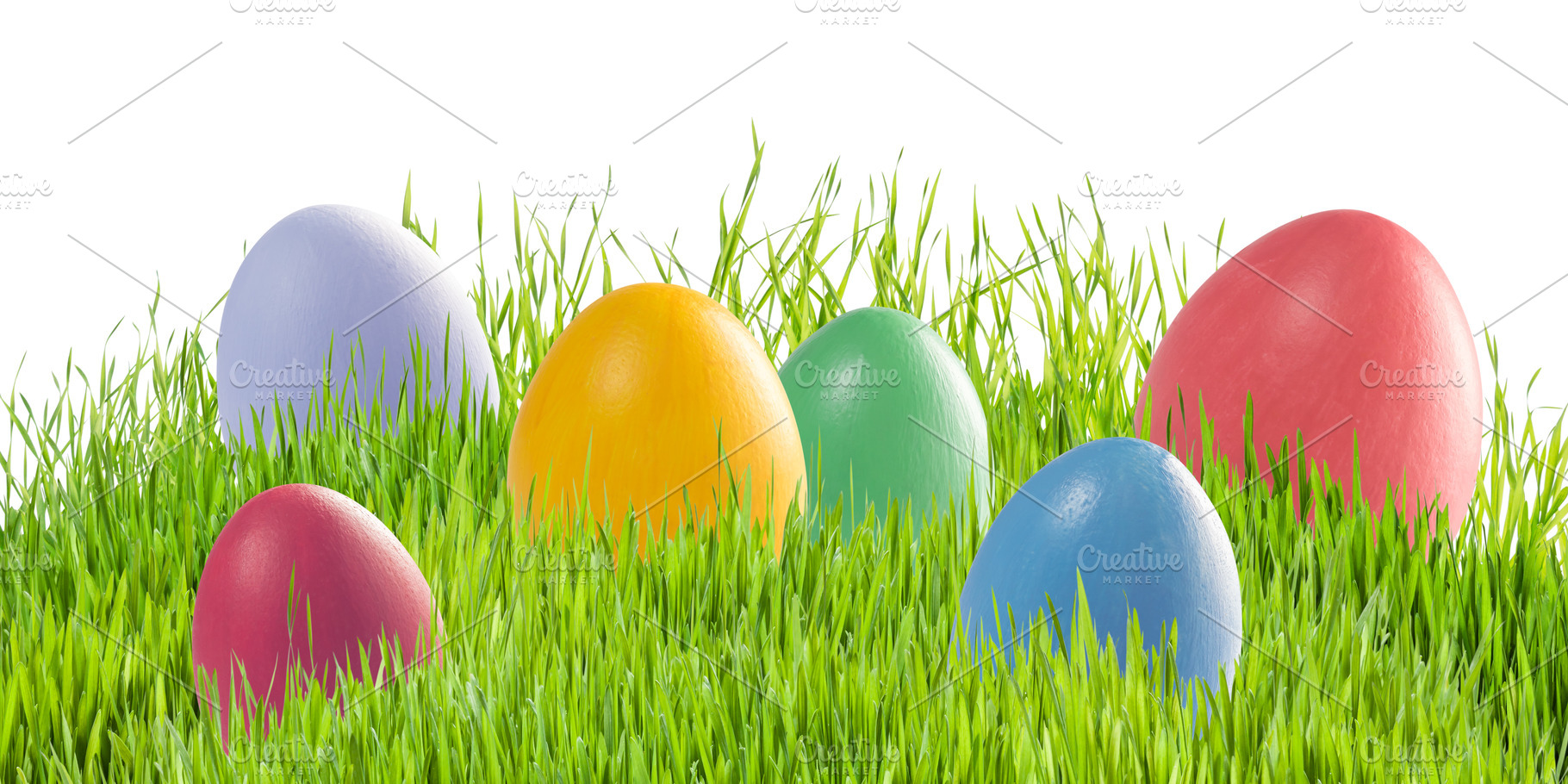 Easter eggs in green grass isolated stock photo containing easter and egg, a Holiday Photo by firewings