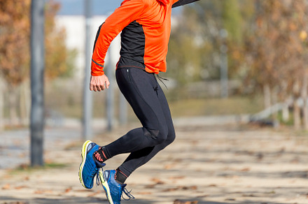 Senior man jumping high outdoors, showing energy and joy