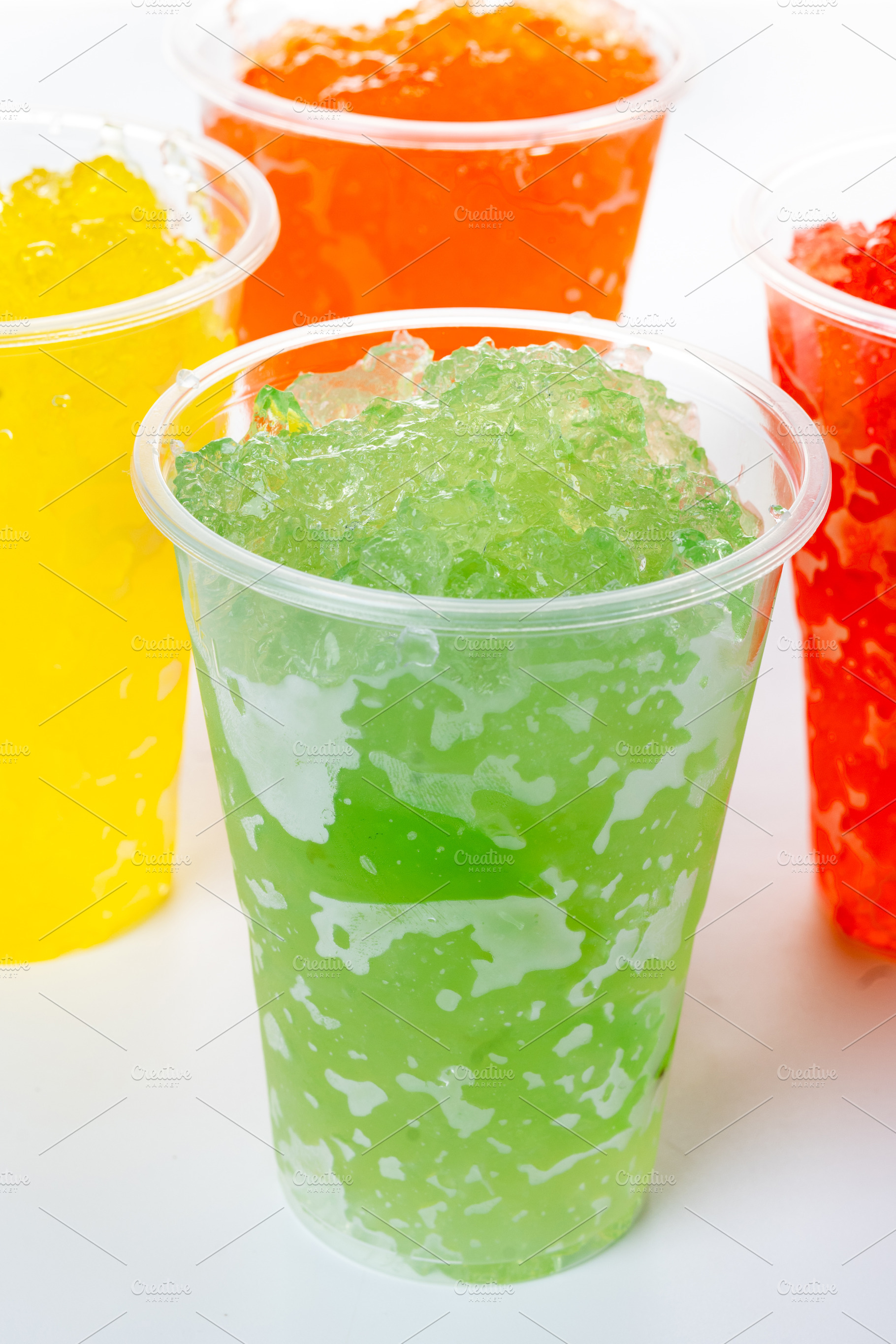 Colorful Frozen Slush Drinks in Plastic Cups, a Photo by etorres69