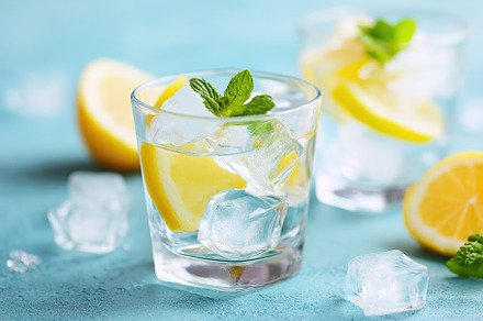 Refreshing drink with ice cubes, lemon slices, and mint leaves for a summer vib, a Food & Drink Photo by AlyaAnd