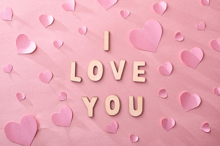 Love background with hearts cutouts and i love you message, a Holiday Photo by Davizro's Market