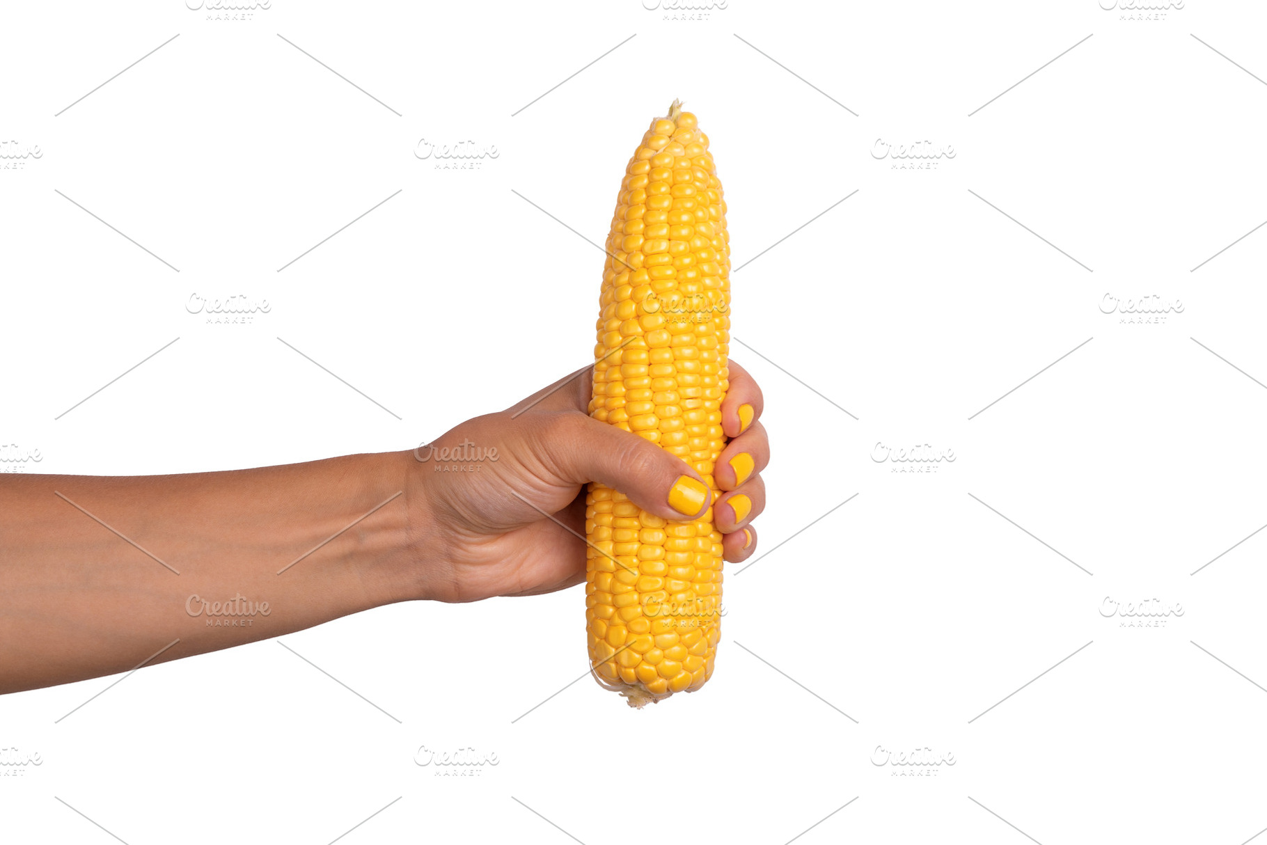 Close-up of a female hand with yellow nails holding a peeled co, a Food & Drink Photo by Ales Munt