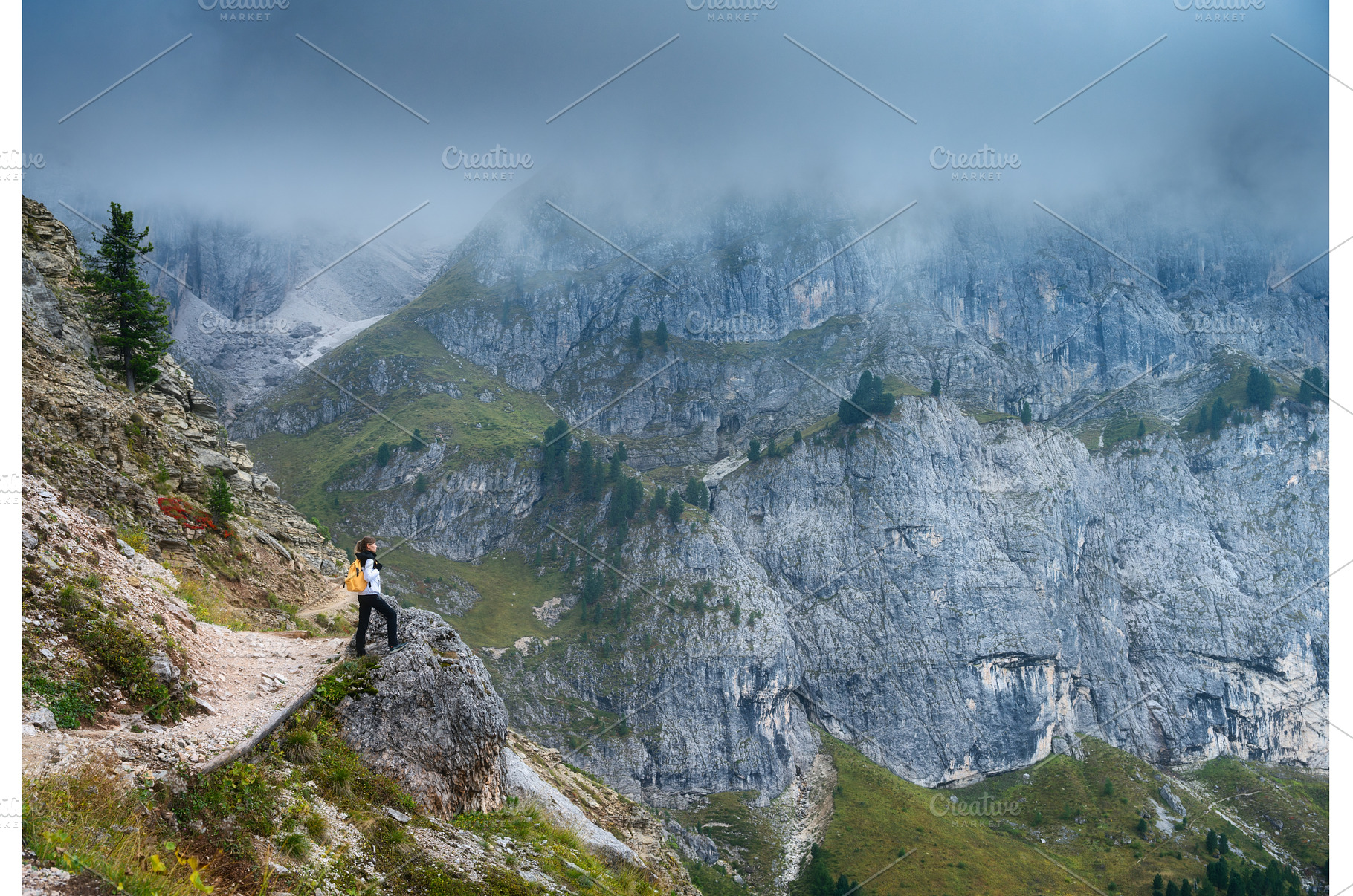 Woman with backpack standing on, a Person Photo by den-belitsky
