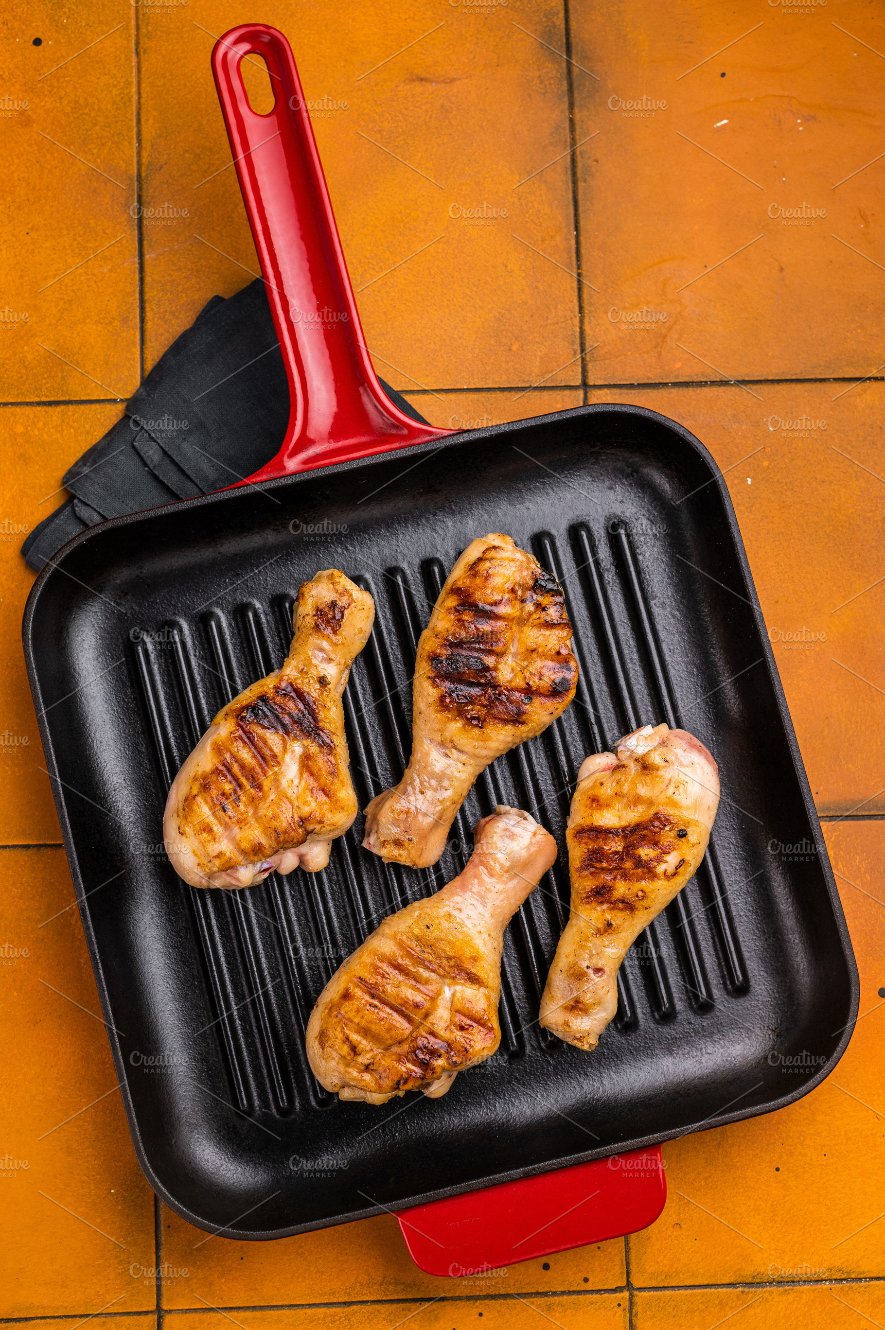 Succulent grilled drumsticks, marinated to perfection and served, a Food & Drink Photo by composter-box@mail.ru