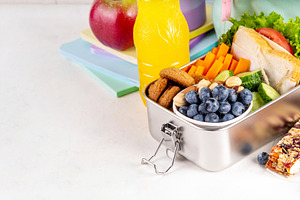 Preparing homemade balanced healthy lunch box for schooler, a Food & Drink Photo by Rimma
