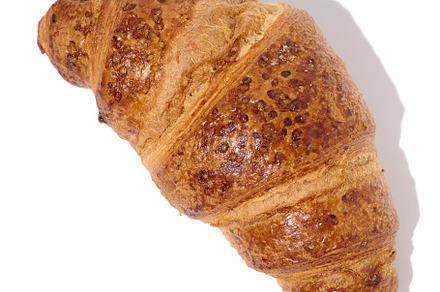 Baked croissant on a white isolated background, top view, a Food & Drink Photo by ndanko