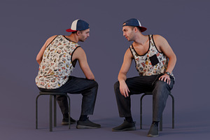 Man In Graphic Tank Top And Cap