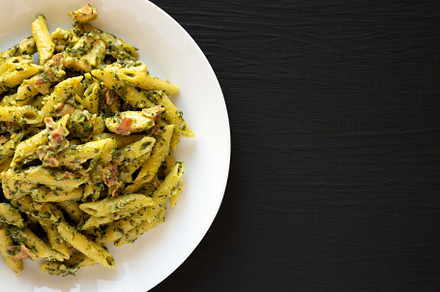 Homemade One-Pot Chicken Spinach Bacon Alfredo Pasta on a plate, a Food & Drink Photo by LiudmylaChuhunova