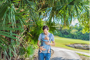Young father walks in nature with, a Person Photo by Elizaveta Galitskaya