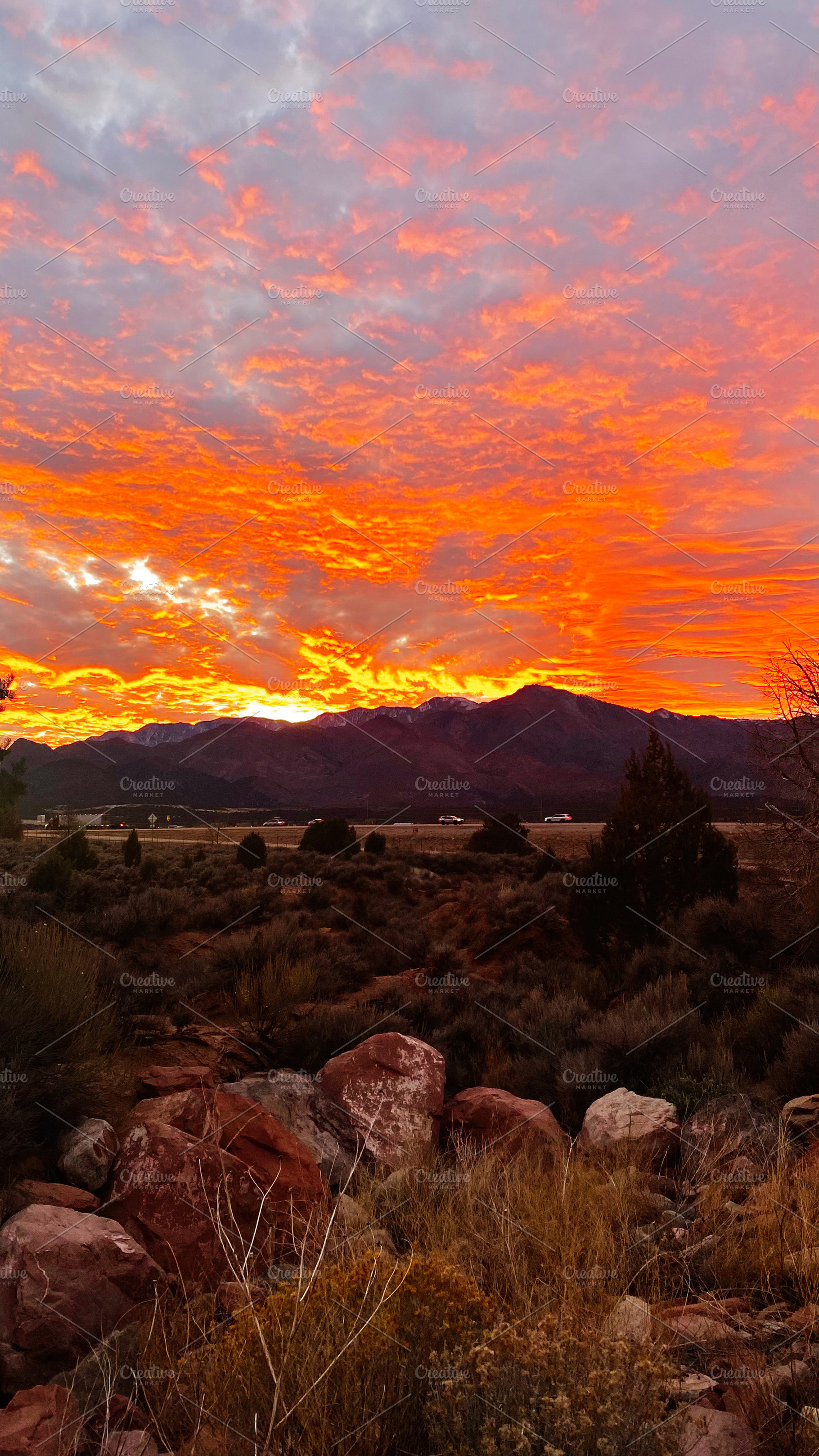 Stunning Utah sunset over desert landscape with orange sky and rugged mountains, a Nature Photo by AS photostudio