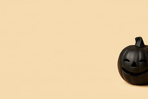 Black jack o lantern on beige Halloween background, a Person Photo by José Manuel Gelpi