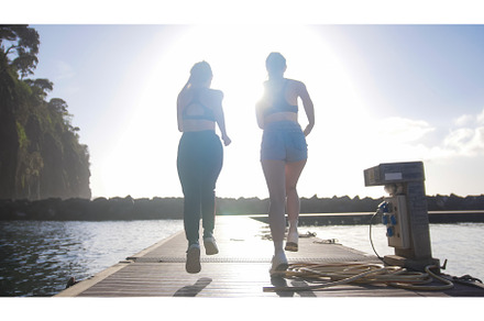 Two young athletic women perform, a Photo by Barcelona_dreams
