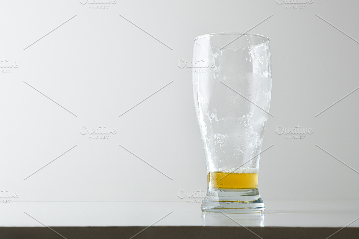 Empty and dirty beer glass with foam isolated on table, a Food & Drink Photo by Davizro's Market (Photo 2 of 2)
