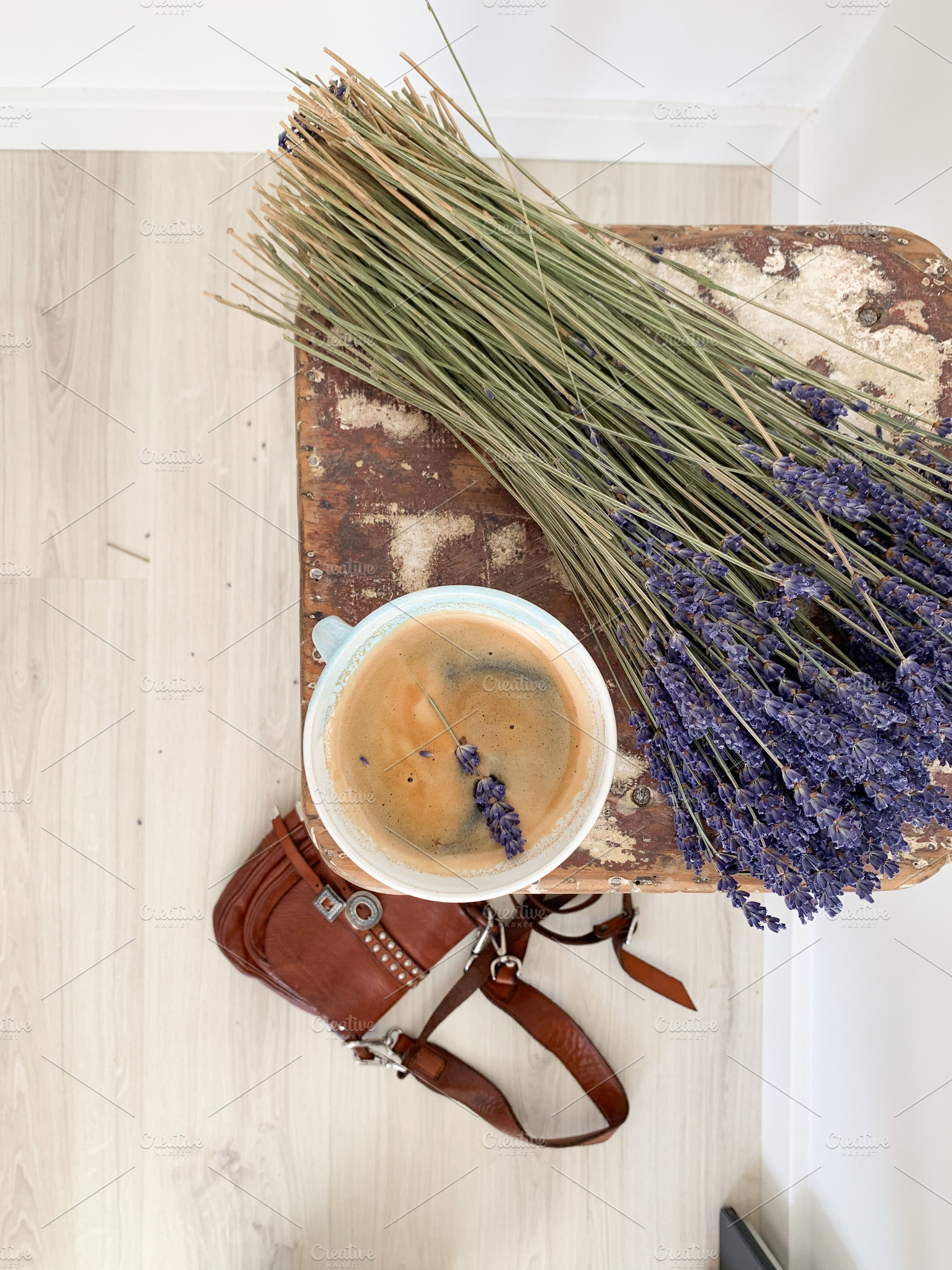 : Top view of a rustic wooden stool with a coffee cup and sprig, a Food & Drink Photo by sebastianaraw