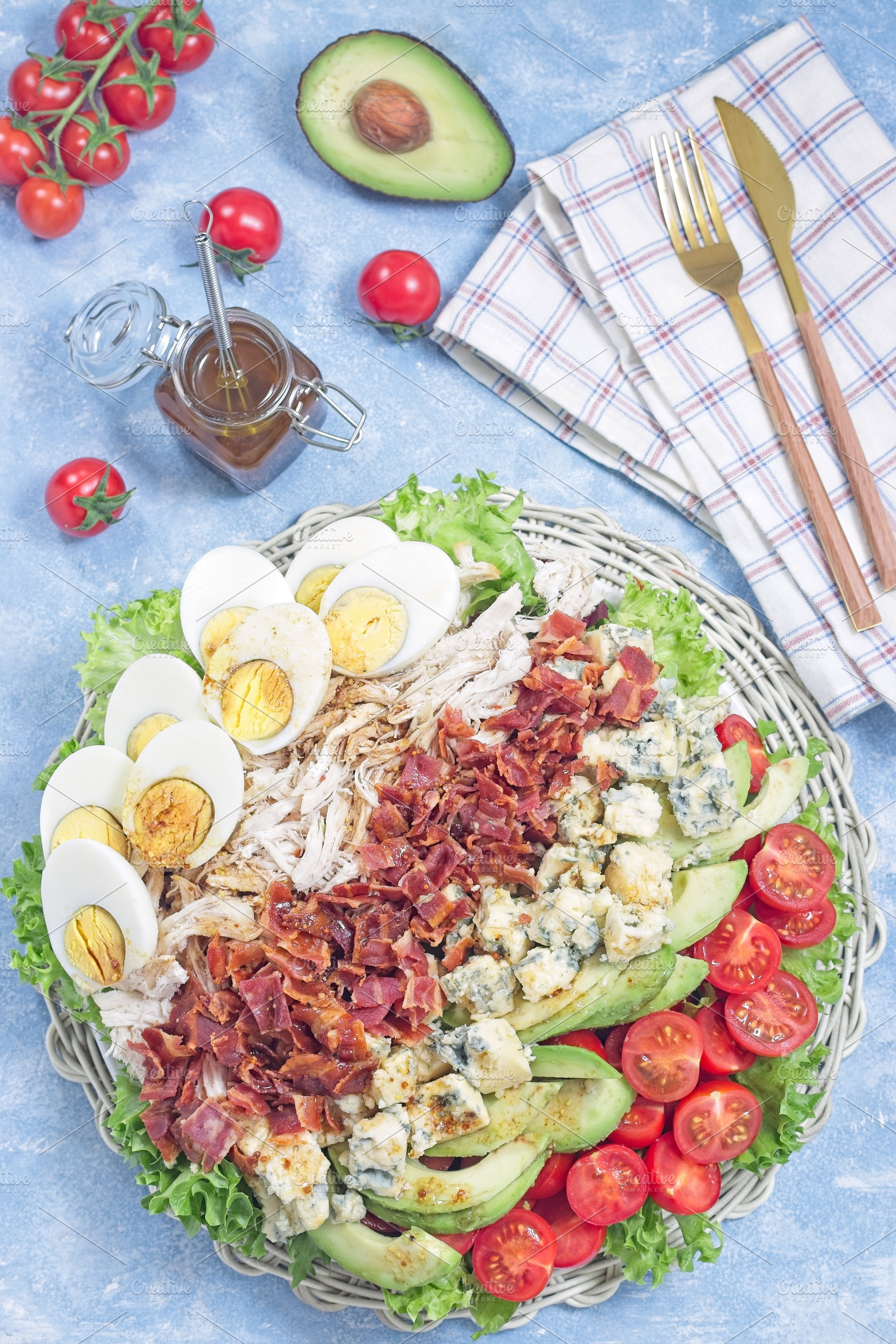 Cobb salad with greens, tomato, avocado, blue cheese, bacon, chicken and eggs,, a Food & Drink Photo by iuliia_n