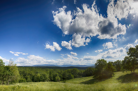 Green mountain valley with blue sky containing green, landscape, and panoramic, a Nature Photo by Rodica Ciorba