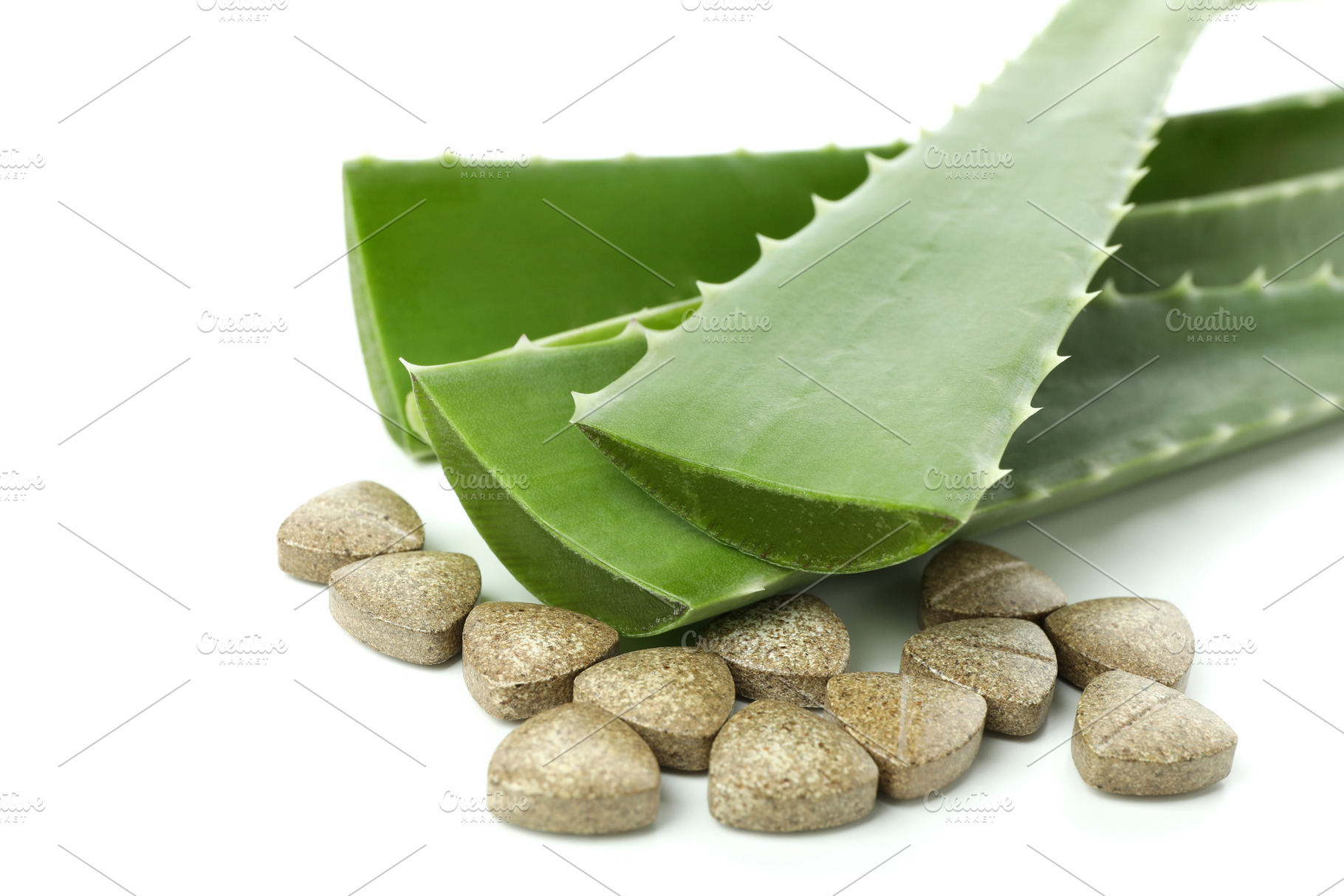 Concept of herb pills with aloe isolated on white background, a Beauty & Fashion Photo by AtlasStudio PRO