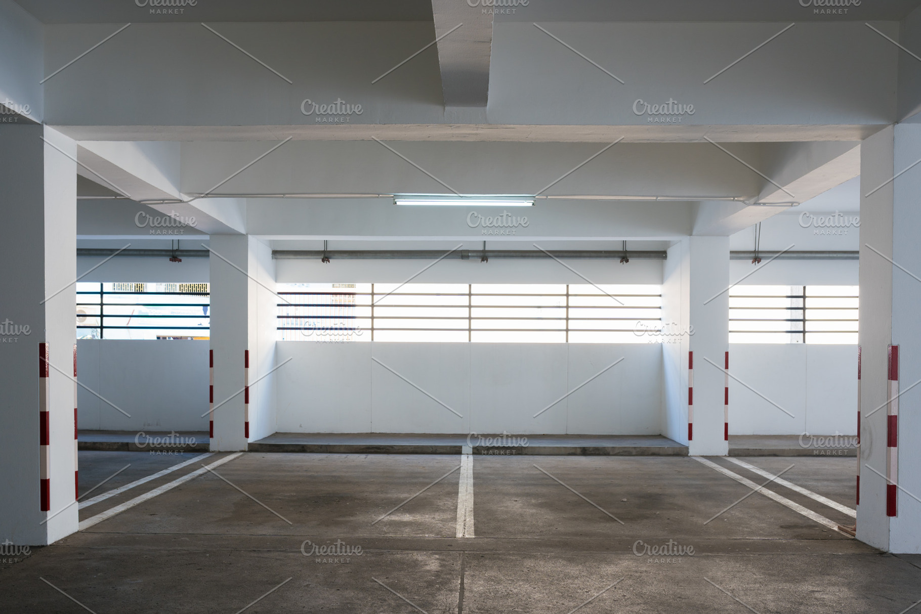 Empty car parking in building, a Transportation Photo by Pushish Images