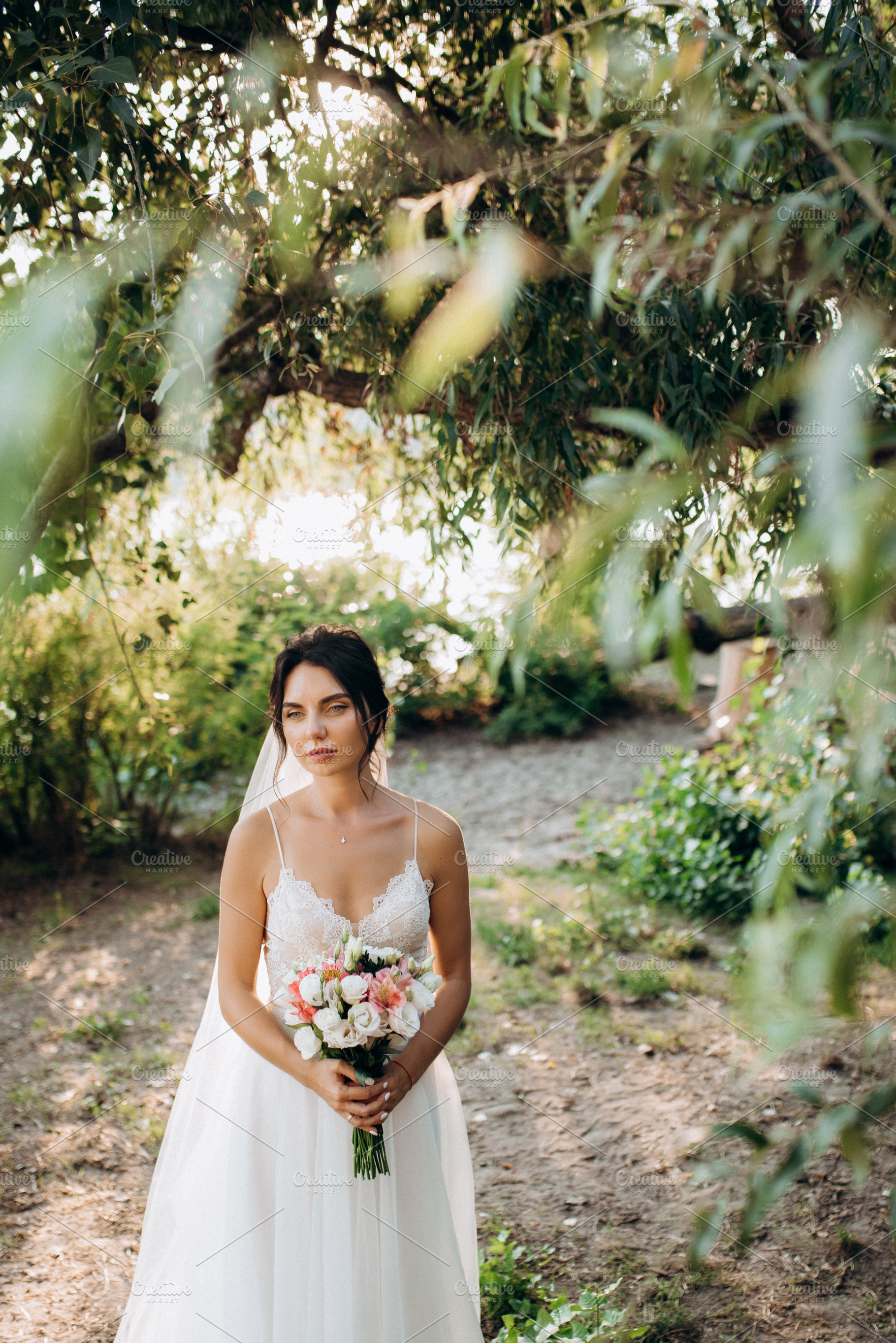 bride blonde girl with a bouquet in the forest, a Person Photo by Weddings, People, Travel