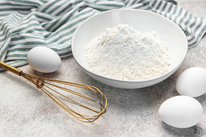 Baking ingredients on counter preparing dough, a Food & Drink Photo by Olena Rudo