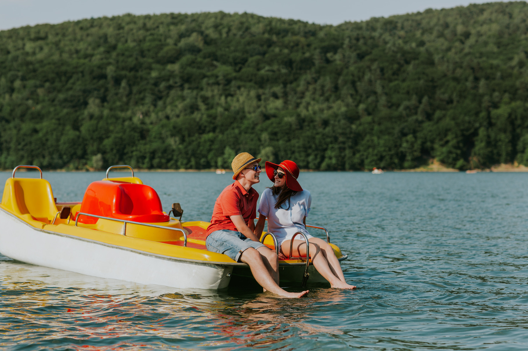Girl and boy dipping toes in water, a Person Photo by Newman Studio