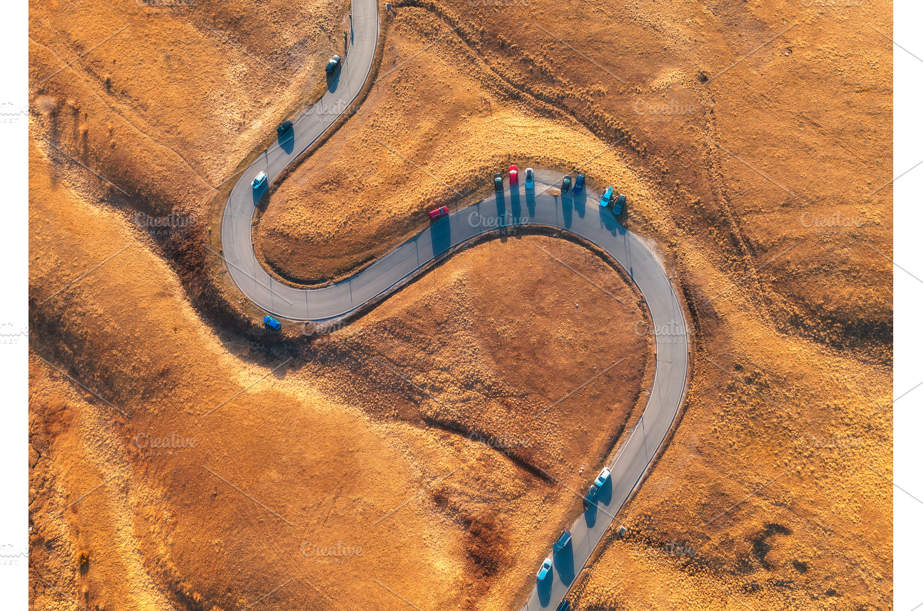 Aerial view of winding road in, a Nature Photo by den-belitsky