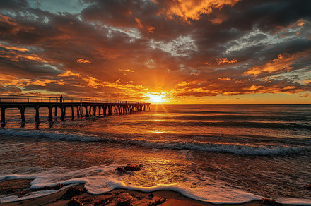 Dramatic sunset over sea pier in Sou, a Photo by Iftikhar Alam