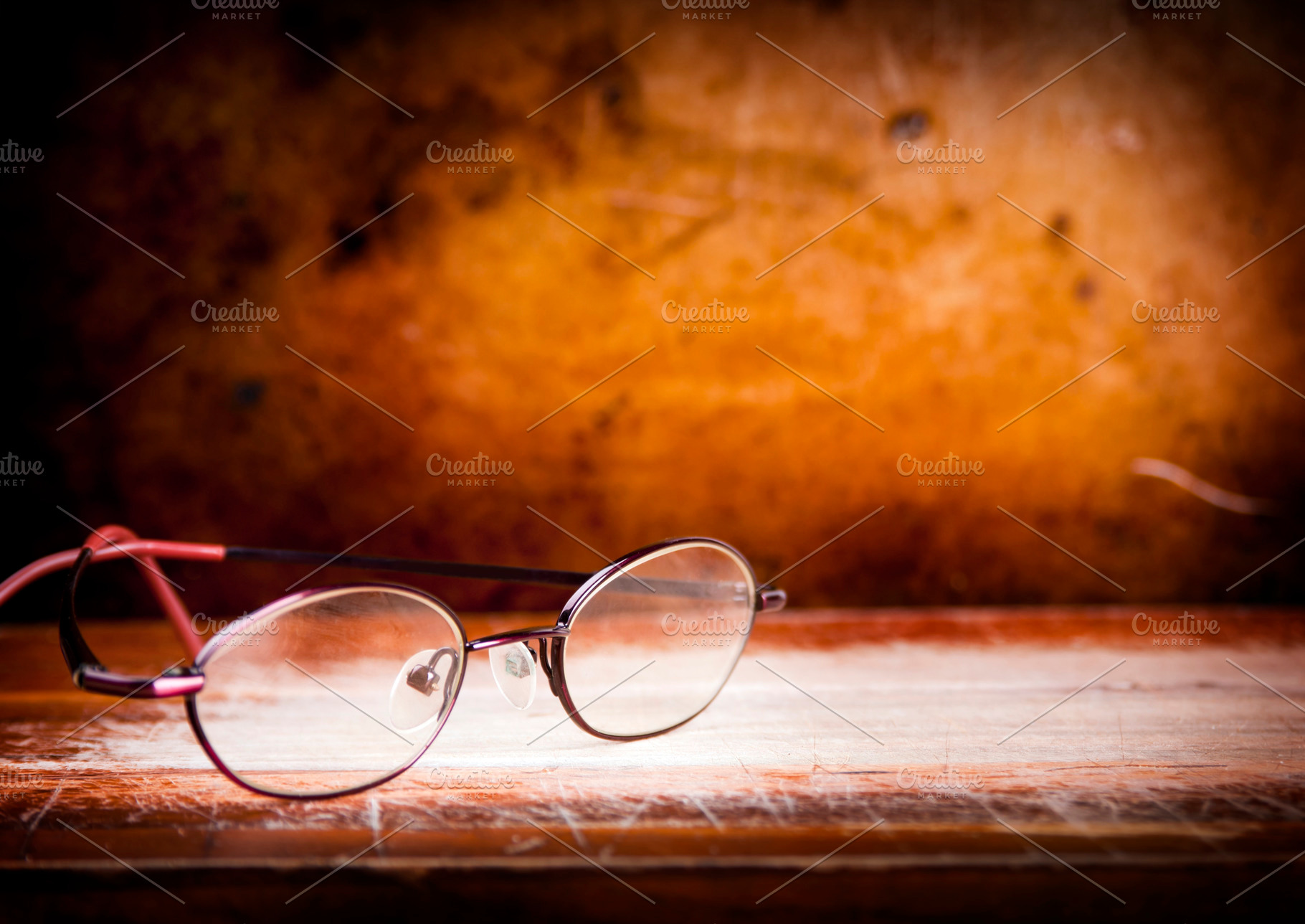 Old Glasses on Desk, a School & Education Photo by THP Creative