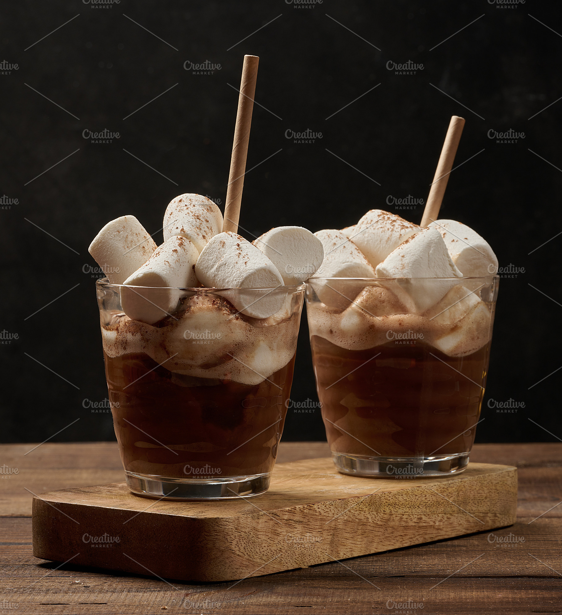 Two glasses of hot chocolate with fluffy marshmallows and a stra, a Food & Drink Photo by ndanko