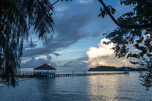 Sunset view of pier on Kadidiri Island, Togian archipelago, Sula, a Nature Photo by GoodGoods